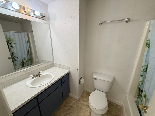 bathroom with a shower with shower curtain, tile patterned flooring, vanity, and toilet