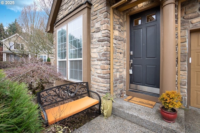 view of exterior entry with stone siding