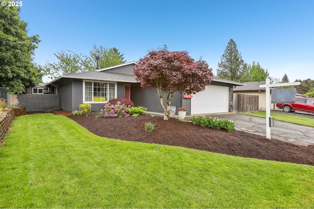view of front of home with a garage and driveway