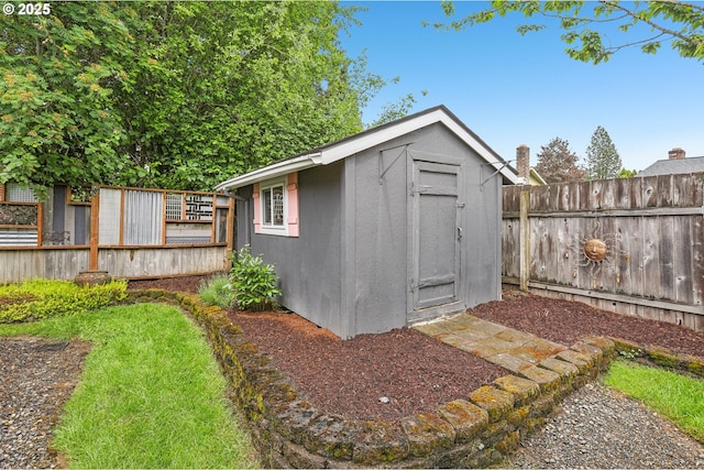 view of shed featuring a fenced backyard