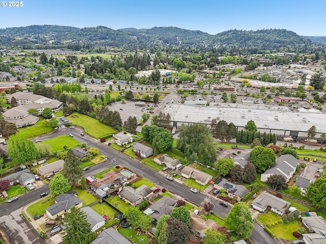 aerial view of residential area featuring a mountainous background