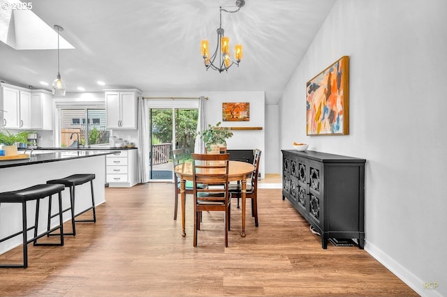 18365 SW Springfield St, Beaverton, OR 97078 - dining space with a chandelier, recessed lighting, light wood finished floors, a skylight, and baseboards