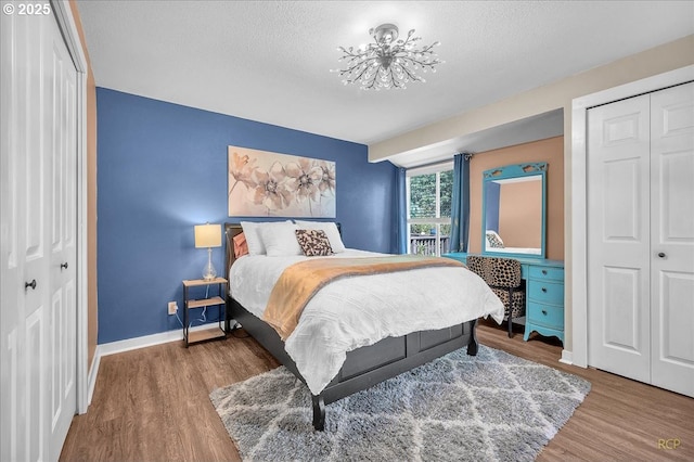 18365 SW Springfield St, Beaverton, OR 97078 - bedroom with wood finished floors, a textured ceiling, baseboards, and a closet