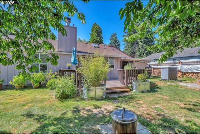 18365 SW Springfield St, Beaverton, OR 97078 - rear view of property with board and batten siding, a deck, and a lawn