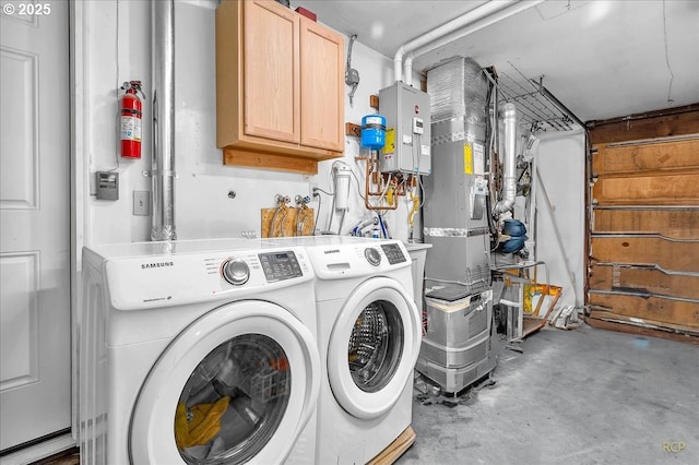 18365 SW Springfield St, Beaverton, OR 97078 - washroom featuring washing machine and dryer and cabinet space