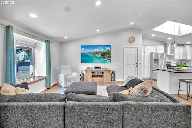18365 SW Springfield St, Beaverton, OR 97078 - living room with light wood-style floors, a skylight, lofted ceiling, baseboards, and recessed lighting