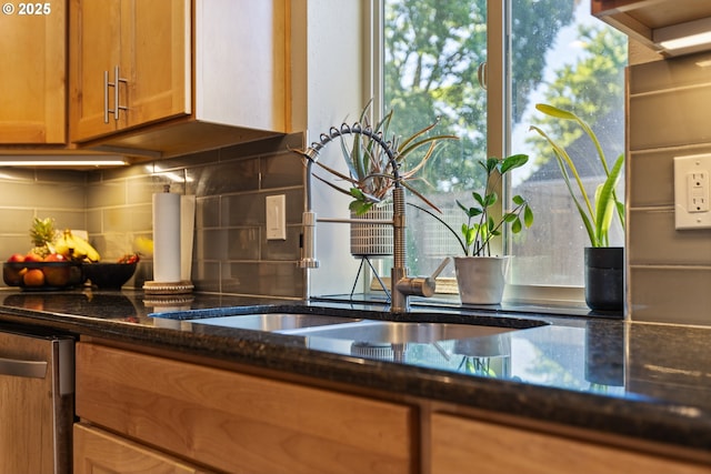13527 SW Ashbury Ln, Portland, OR 97223 - kitchen view of backsplash, dark stone countertops, brown cabinets, and dishwasher