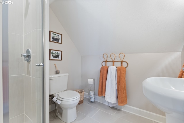 13527 SW Ashbury Ln, Portland, OR 97223 - bathroom with a shower stall, vaulted ceiling, and tile patterned flooring