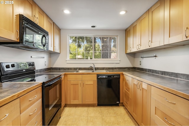 2702 Fairmount Ave, Vancouver, WA 98661 - kitchen with black appliances, recessed lighting, a sink, and tile countertops