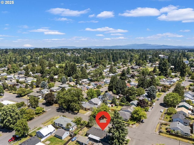 2702 Fairmount Ave, Vancouver, WA 98661 - aerial perspective of suburban area with a heavily wooded area and a mountain backdrop