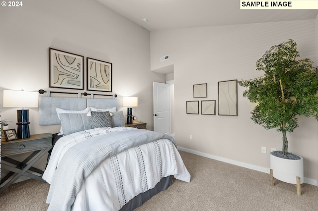 carpeted bedroom featuring high vaulted ceiling, visible vents, and baseboards