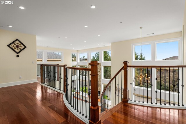 4018 NW Riggs Dr, Portland, OR 97229 - corridor featuring visible vents, baseboards, an upstairs landing, hardwood / wood-style flooring, and recessed lighting