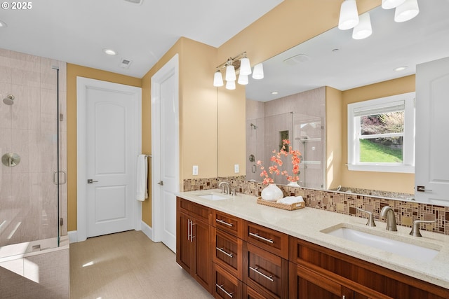 4018 NW Riggs Dr, Portland, OR 97229 - full bathroom featuring a stall shower, double vanity, a sink, and backsplash