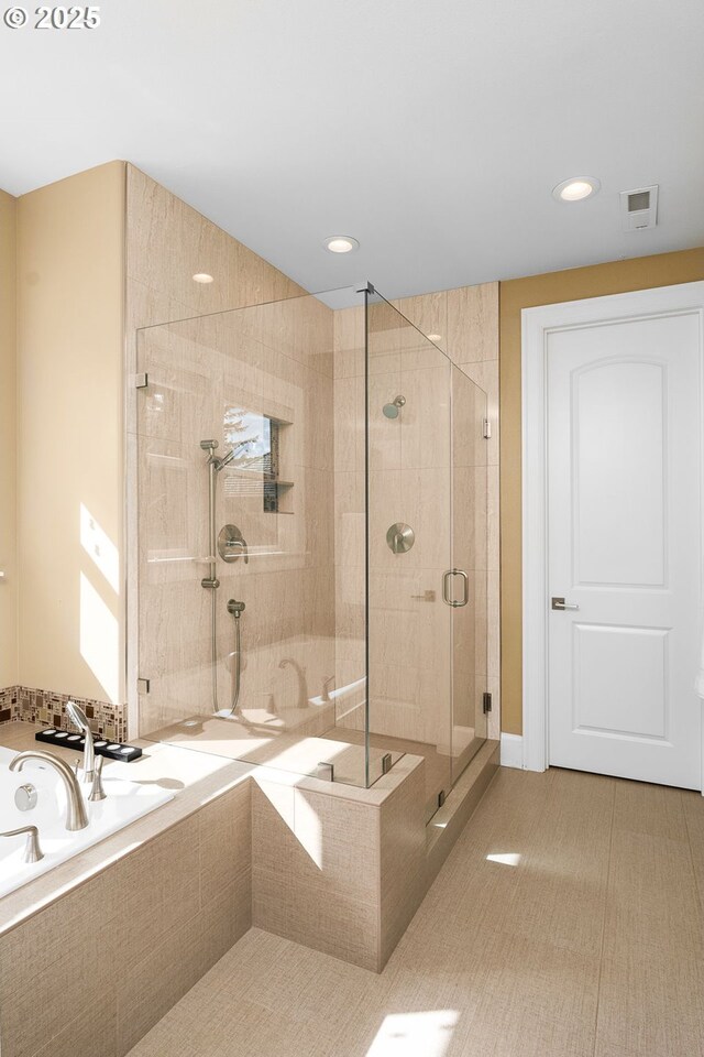 4018 NW Riggs Dr, Portland, OR 97229 - bathroom featuring visible vents, a shower stall, recessed lighting, and a garden tub