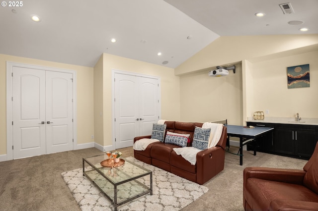 4018 NW Riggs Dr, Portland, OR 97229 - living area featuring recessed lighting, visible vents, light colored carpet, and vaulted ceiling