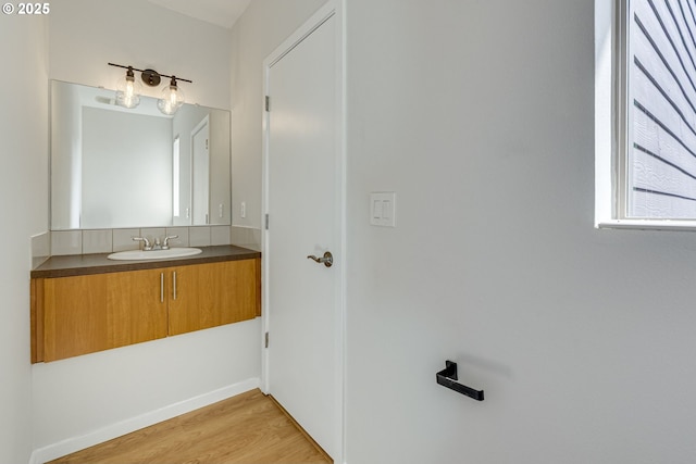 8522 N Central St Unit 17-1, Portland, OR 97203 - bathroom with wood finished floors, vanity, and baseboards