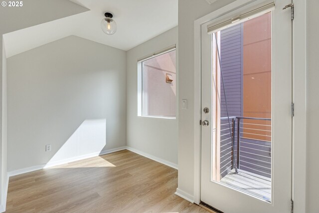 8522 N Central St Unit 17-1, Portland, OR 97203 - doorway featuring light wood-type flooring, baseboards, and vaulted ceiling