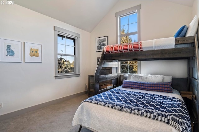 carpeted bedroom featuring vaulted ceiling