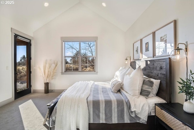 bedroom featuring lofted ceiling, access to exterior, multiple windows, and light colored carpet