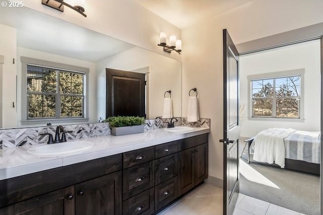 bathroom with a healthy amount of sunlight and vanity