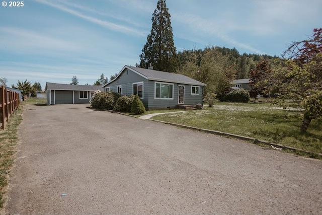 82877 Butte Rd, Creswell, OR 97426 - view of front facade featuring an outdoor structure, driveway, and a garage