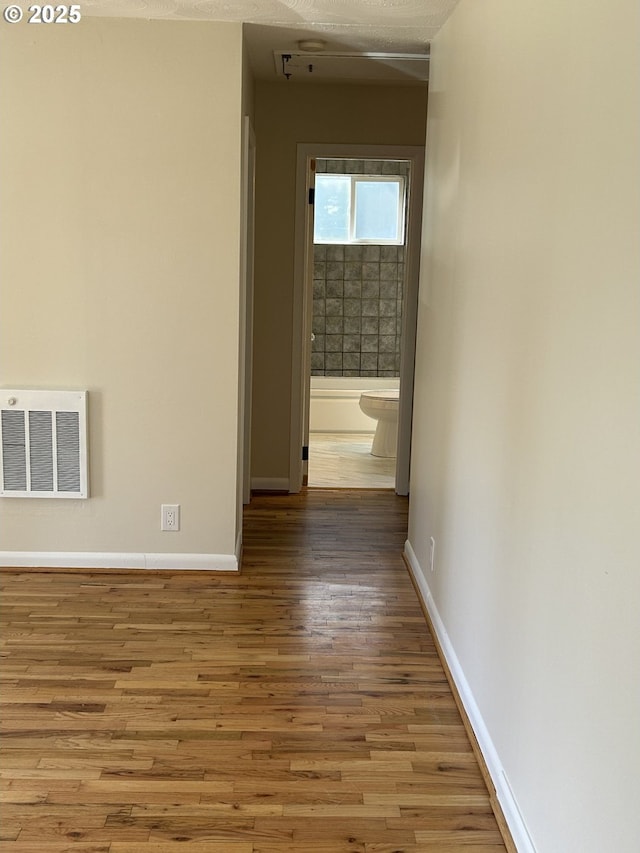 9804 NE 2nd St, Vancouver, WA 98664 - corridor featuring visible vents, wood finished floors, and baseboards