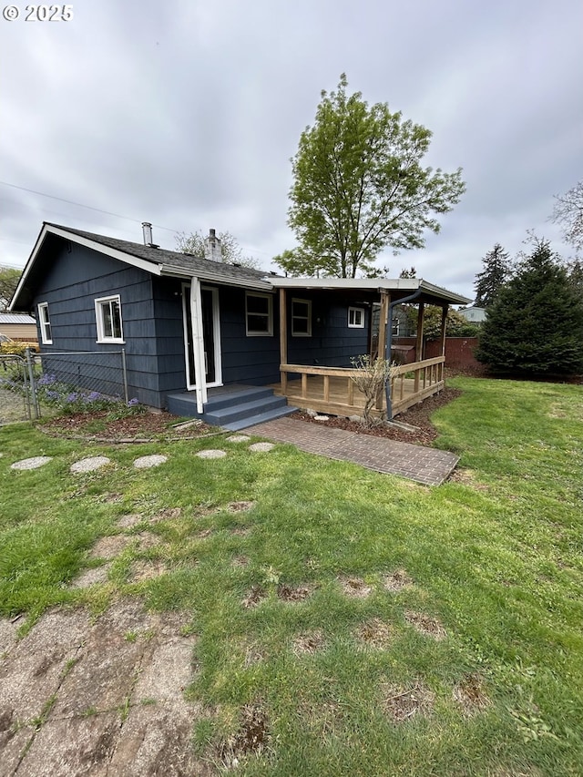 9804 NE 2nd St, Vancouver, WA 98664 - rear view of property with fence and a yard