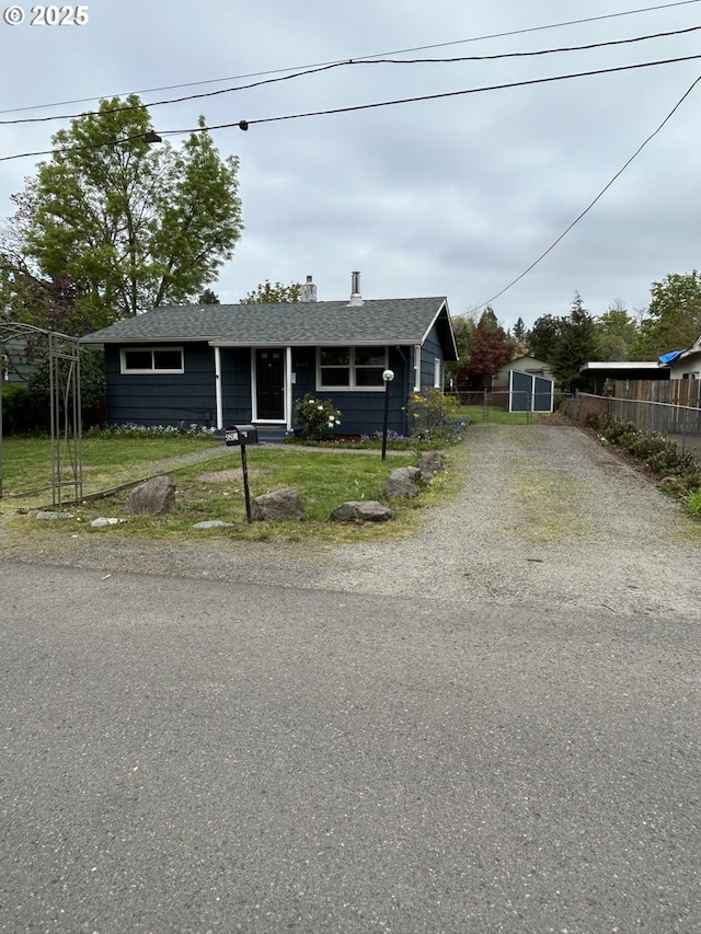 9804 NE 2nd St, Vancouver, WA 98664 - ranch-style home featuring a chimney, fence, driveway, roof with shingles, and a front yard