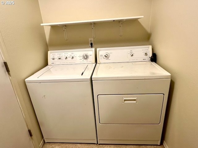 washroom with washer and clothes dryer