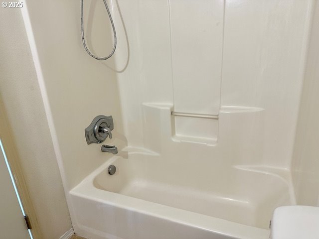 bathroom featuring bathing tub / shower combination