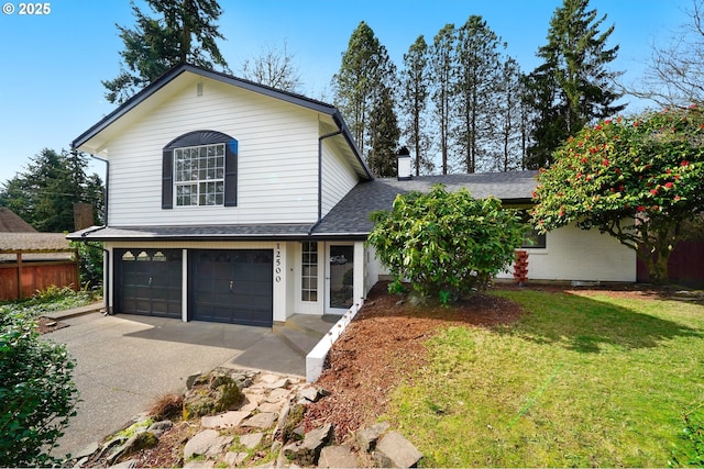 traditional home featuring a garage, driveway, a front yard, and a shingled roof