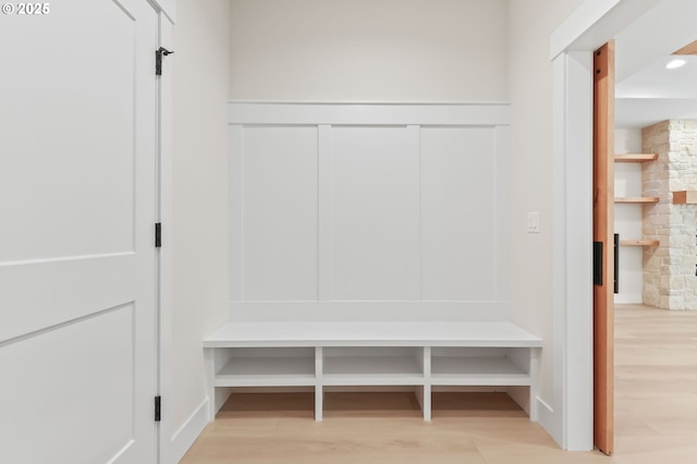 648 Parker Loop, Silverton, OR 97381 - mudroom featuring light wood-style floors and a decorative wall