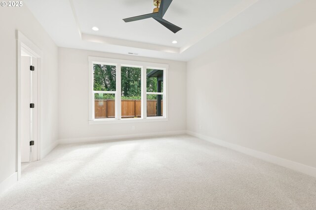 648 Parker Loop, Silverton, OR 97381 - spare room featuring carpet floors, a raised ceiling, baseboards, recessed lighting, and a ceiling fan
