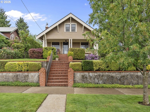 3541 NE 72nd Ave, Portland, OR 97213 - bungalow featuring stairs, a porch, a front lawn, and a chimney