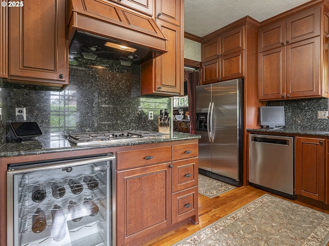 3541 NE 72nd Ave, Portland, OR 97213 - kitchen featuring stainless steel appliances, light wood-style flooring, and brown cabinets