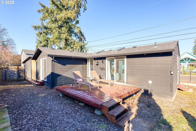 rear view of house with a wooden deck