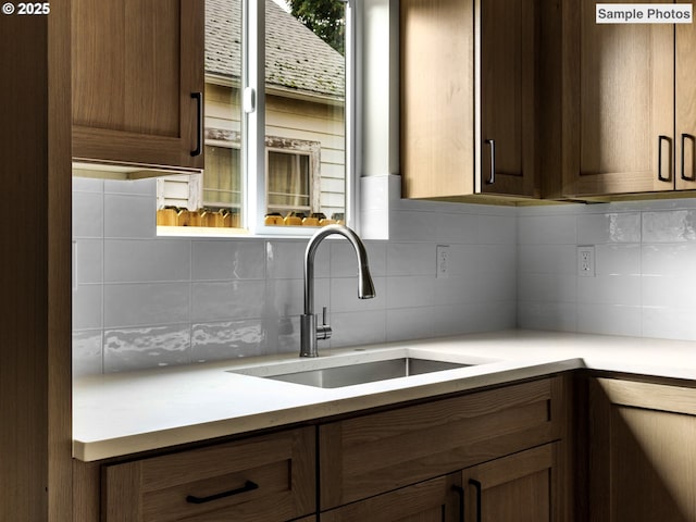 5866 N Missouri Ave Unit 4, Portland, OR 97206 - kitchen with a sink, backsplash, and light countertops