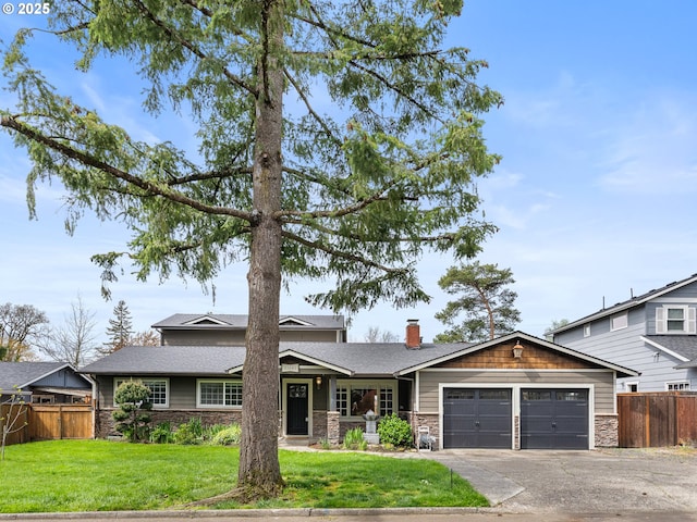 13145 SW 61st Ave, Portland, OR 97219 - view of front facade featuring stone siding, an attached garage, concrete driveway, and a chimney