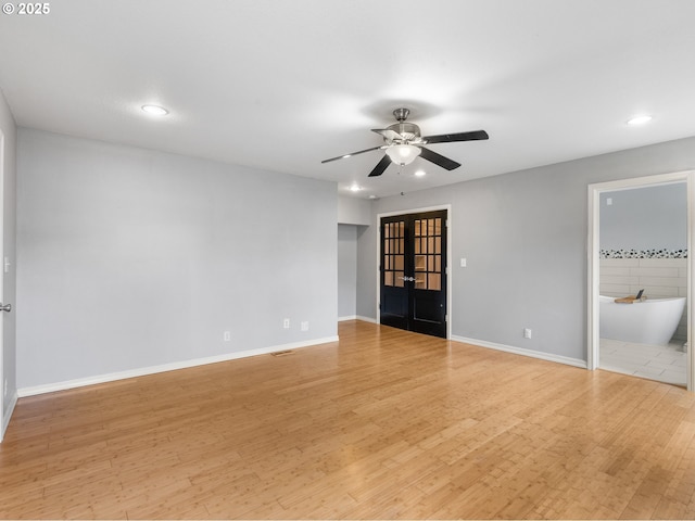 13145 SW 61st Ave, Portland, OR 97219 - unfurnished bedroom featuring recessed lighting, french doors, light wood-style floors, baseboards, and ensuite bath