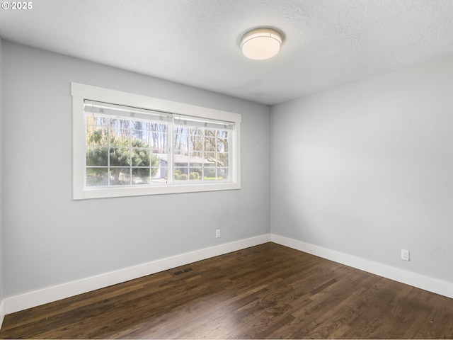 13145 SW 61st Ave, Portland, OR 97219 - unfurnished room with dark wood-style floors and baseboards