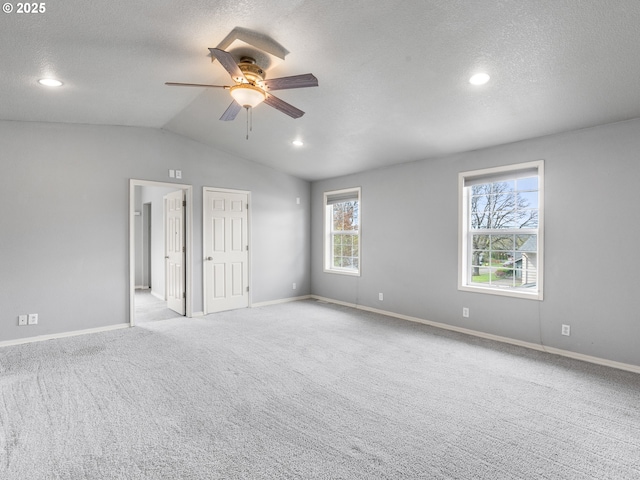 13145 SW 61st Ave, Portland, OR 97219 - unfurnished bedroom featuring vaulted ceiling, a textured ceiling, carpet flooring, baseboards, and recessed lighting