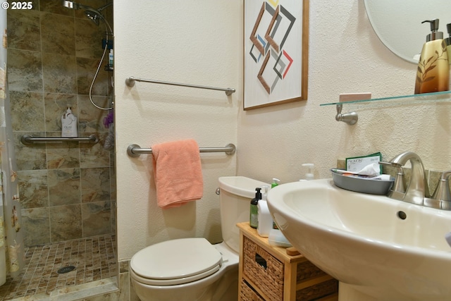 5902 NE 11th Ave, Portland, OR 97211 - full bath with a stall shower, toilet, a sink, and a textured wall