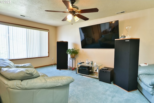 5902 NE 11th Ave, Portland, OR 97211 - carpeted living room with a ceiling fan, a textured ceiling, and baseboards