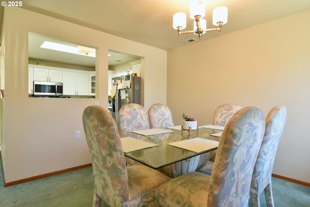 5902 NE 11th Ave, Portland, OR 97211 - carpeted dining space with a chandelier and baseboards