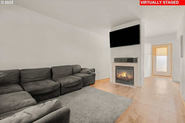 15647 NE Beech St, Portland, OR 97230 - living area featuring light wood finished floors and a tile fireplace