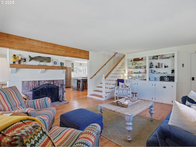652 Nita Ave, Gearhart, OR 97138 - living area with stairway, light wood finished floors, and a fireplace