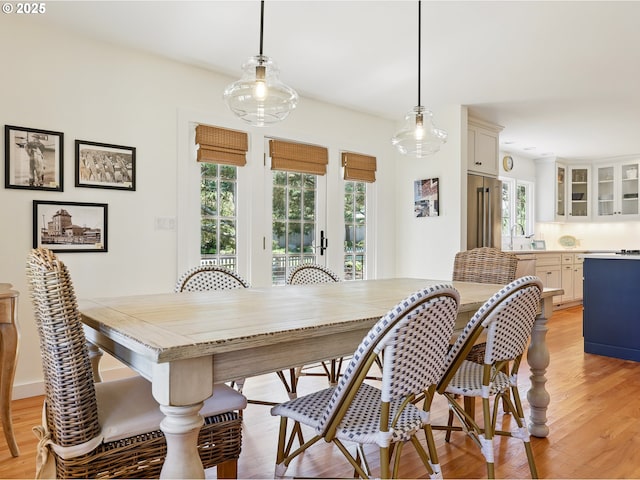 652 Nita Ave, Gearhart, OR 97138 - dining room featuring plenty of natural light, light wood-style floors, and french doors