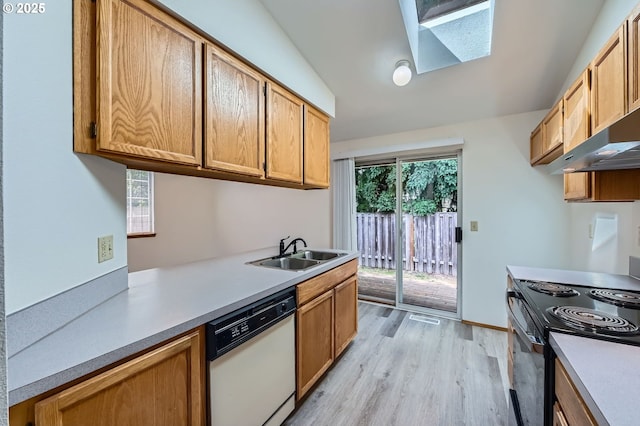 21122 NW Cannes Dr, Portland, OR 97229 - kitchen with dishwasher, black electric range, a skylight, light wood finished floors, and light countertops