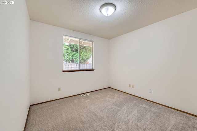 21122 NW Cannes Dr, Portland, OR 97229 - unfurnished room featuring carpet floors and a textured ceiling
