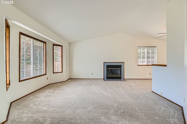21122 NW Cannes Dr, Portland, OR 97229 - unfurnished living room with carpet flooring, lofted ceiling, and a fireplace